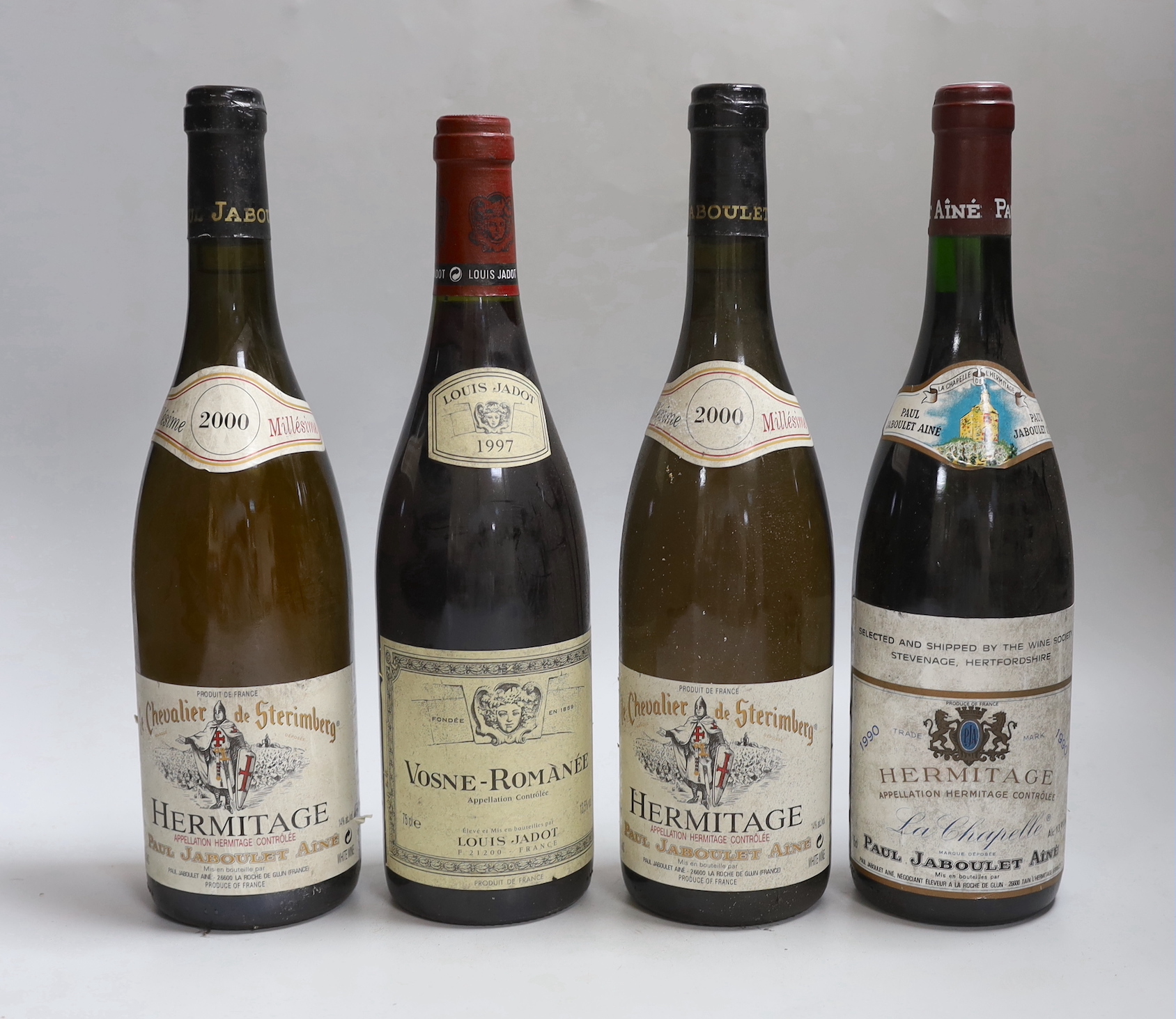 Four bottles of wine: two bottles of 75cl 2000 Paul Jaboulet Aine Hermitage le Cheulier de Sterimberg, one bottle of 75cl 1990 Paul Jaboulet Aine Hermitsge La Chapelle, and one bottle of 75cl Louis Jadot Vosne-Romanée